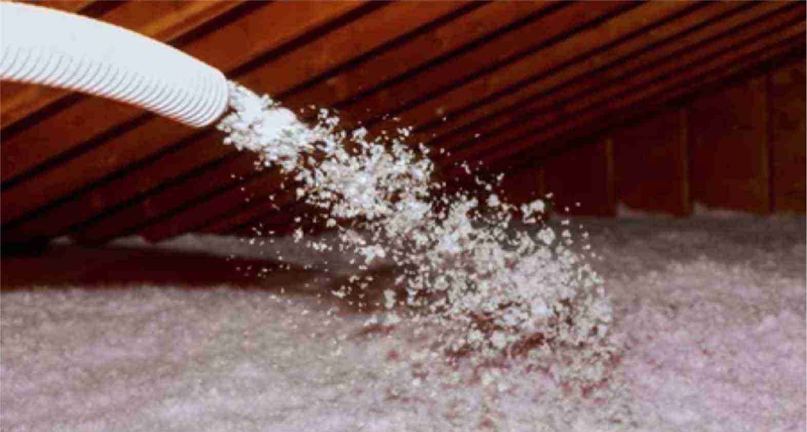 Blow-in-insulation Hose in attic blowing in blown in insulation.